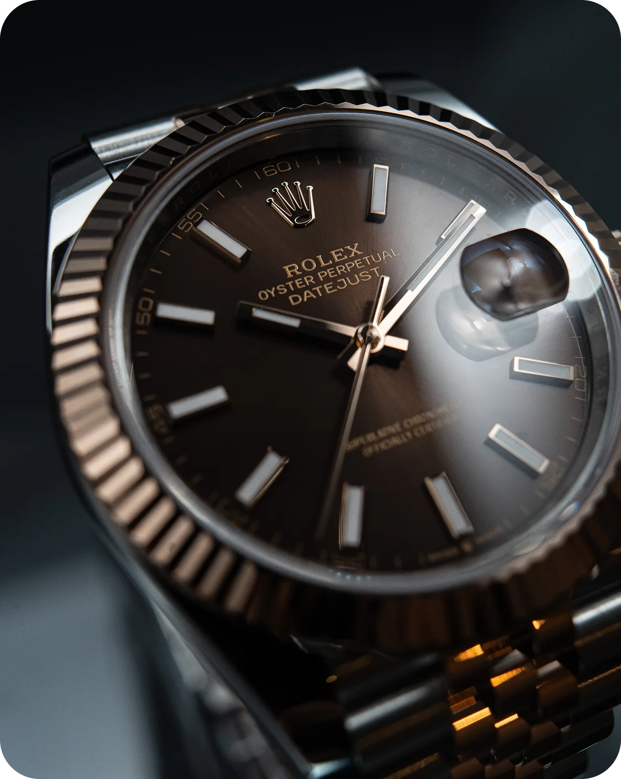 Close view of a Rolex dial with a fluted bezel