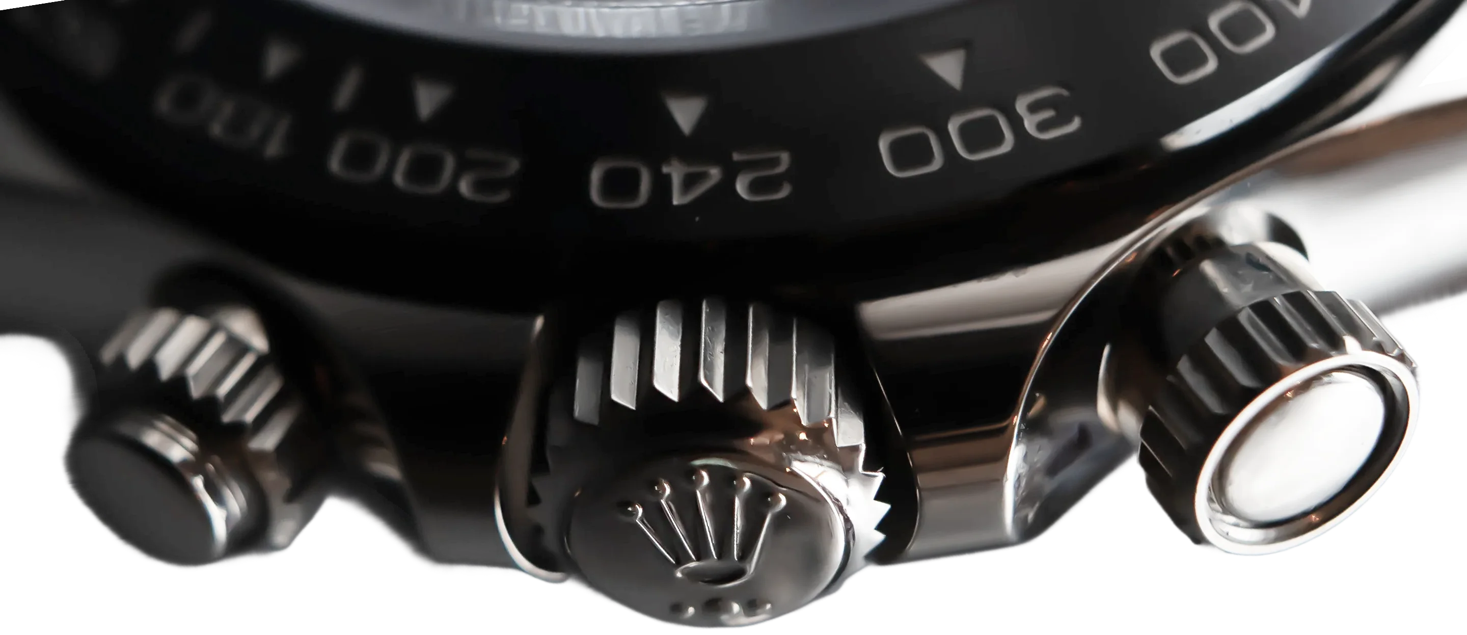Bezel and crown of a Rolex sports watch