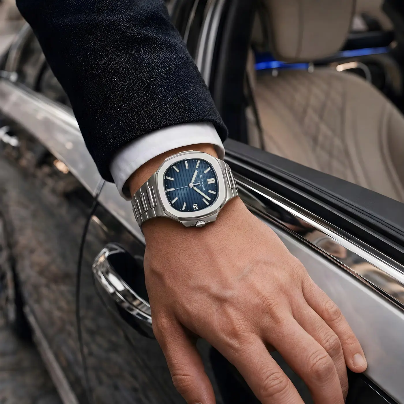 Patek Philippe Nautilus with a blue dial on a wrist
