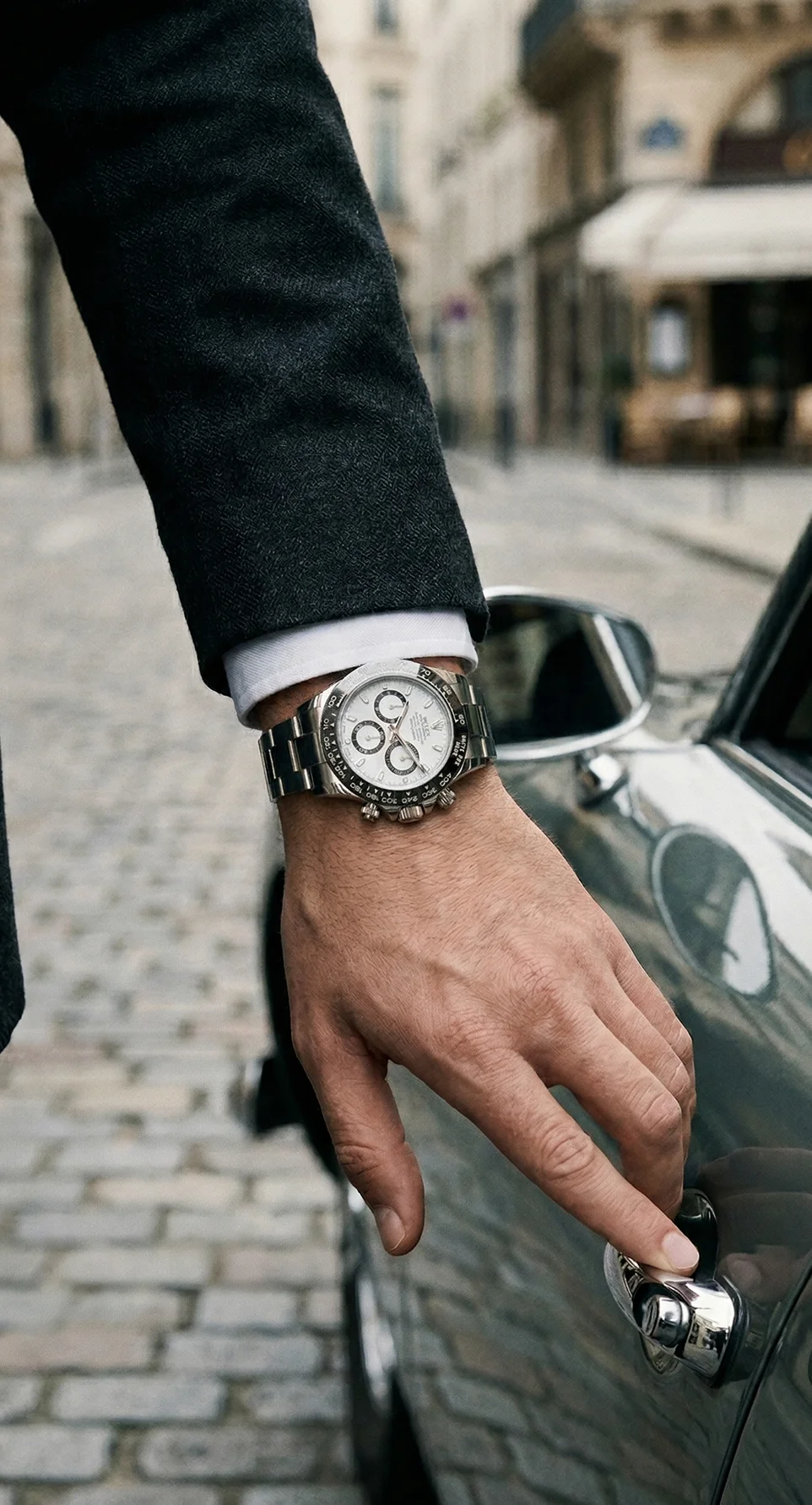 Rolex Daytona with a white dial on a wrist